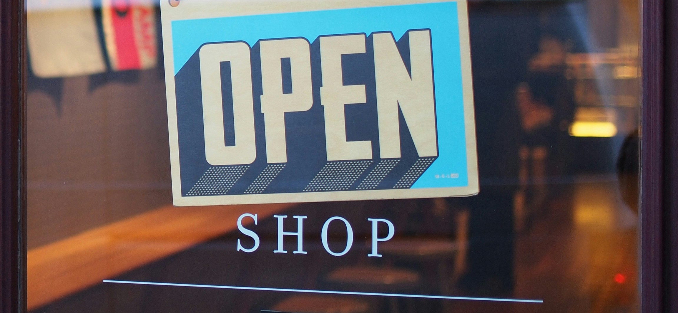 photograph of shop open sign